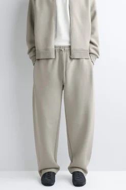 COTTON-PIQUÉ OVERSIZED BARREL-LEG JOGGERS