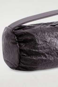 CYLINDER CLUTCH BAG - TEXTURED-LEATHER