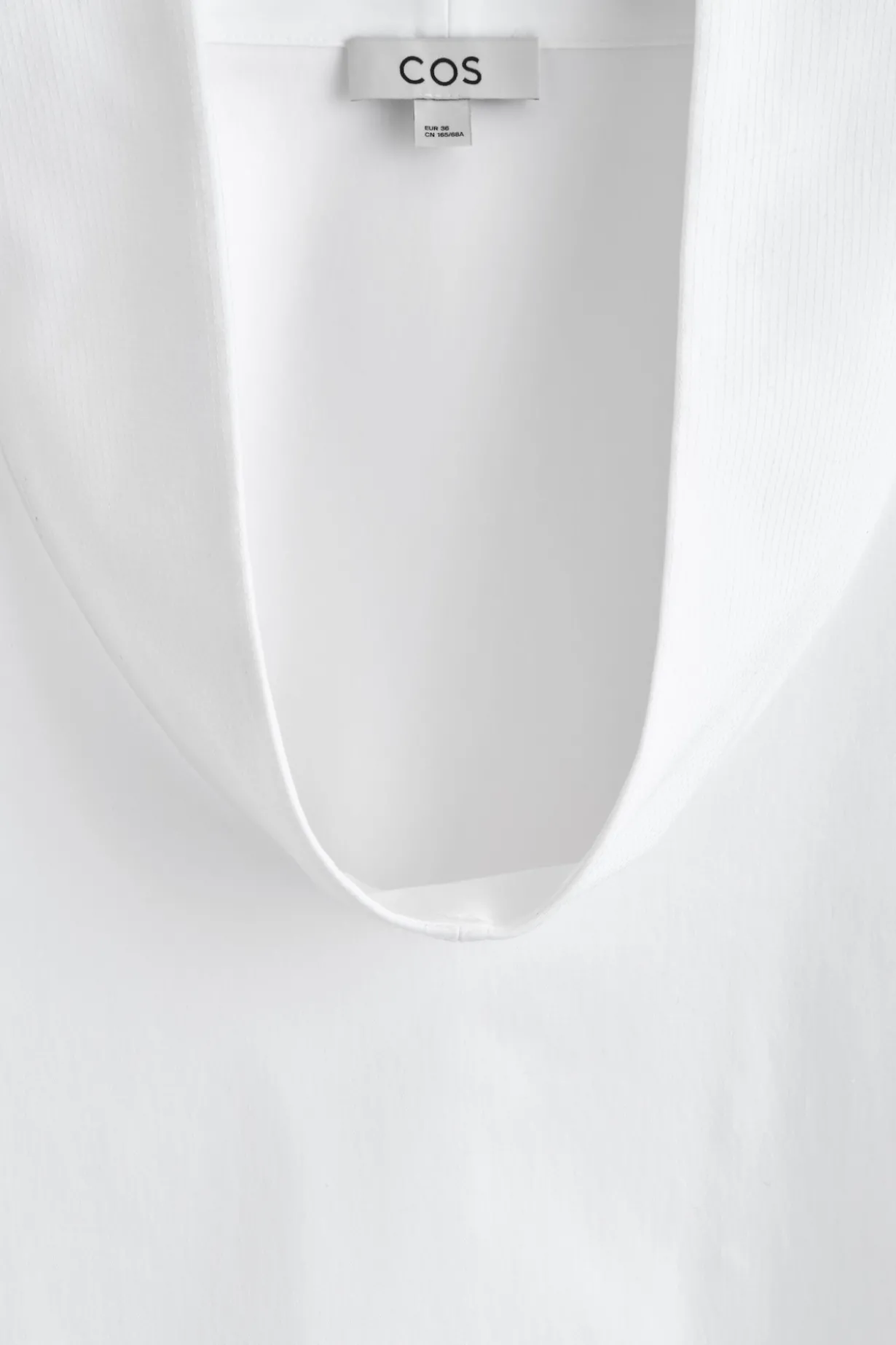 EXAGGERATED MOCK-NECK TOP