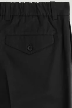PLEATED RELAXED-FIT TAPERED PANTS