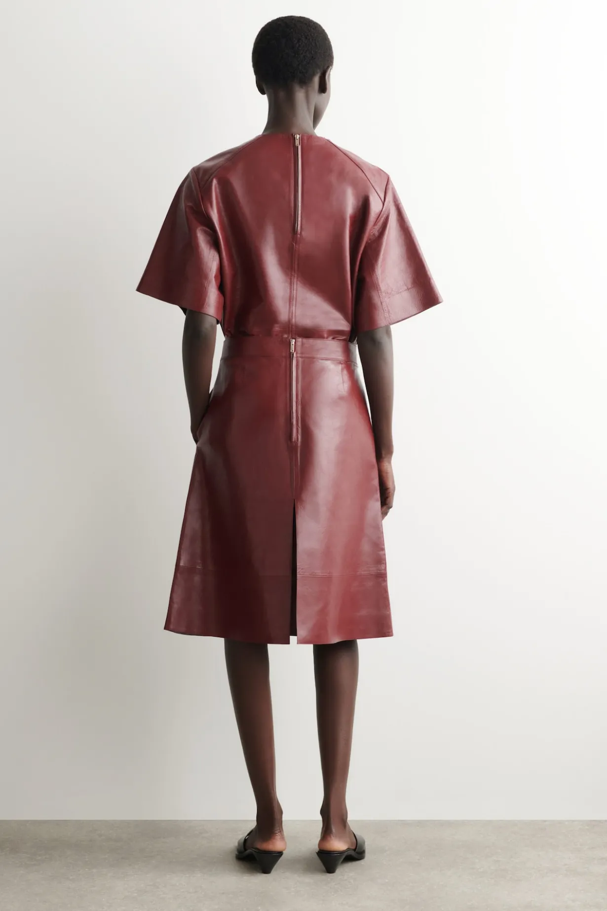 PLEATED TEXTURED-LEATHER MIDI SKIRT