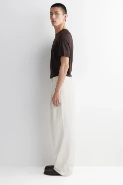 PLEATED WIDE-LEG DENIM PANTS