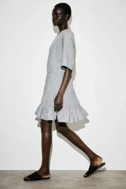 SMOCKED SEERSUCKER MINI DRESS
