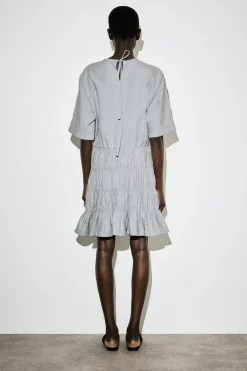 SMOCKED SEERSUCKER MINI DRESS